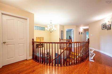 Hardwood floors continue upstairs through the hallways