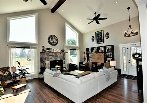 living room with large windows and soaring ceilings 