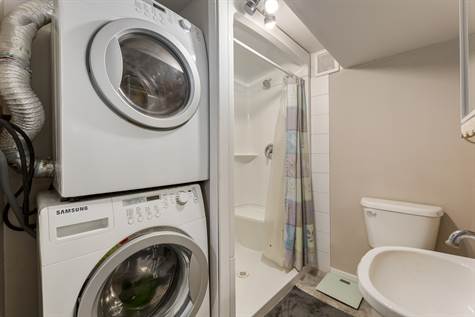 The second set of the washer and dryer in the basement.
