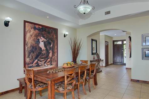 Beautiful dining area with arched entry.