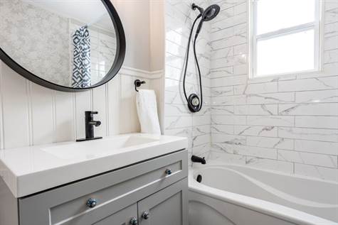 RENO'D Full Bath w/NEW Modern Tile Floors, Vanity, Modern Black Mirror, Tub w/Subway Tile Shower & Black Faucet/Shower Head (2022)
