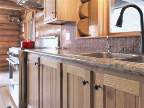 Classy kitchen features and oak cabinetry