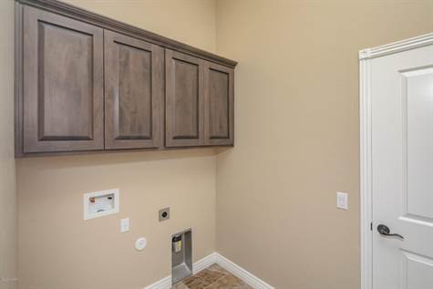 Separate Laundry Room w/ Storage