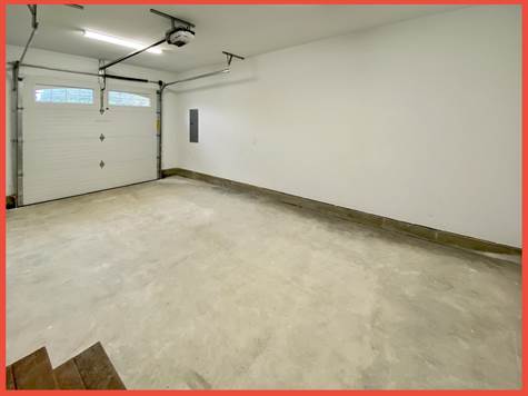 Oversized 1-car garage w/remote entry. Pic of model.