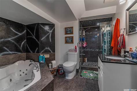 Basement bathroom, heated tile floor, walk-in tile shower, air/jet tub