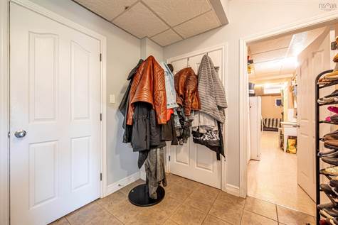 The mudroom off of the garage also offers a cold room closet for storing your produce and pickles
