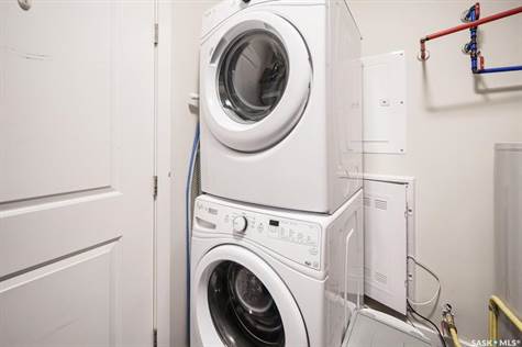 Laundry room with stackable appliances.