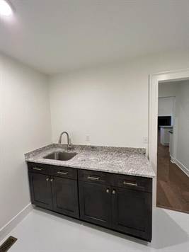 Laundry room with access to primary bedroom