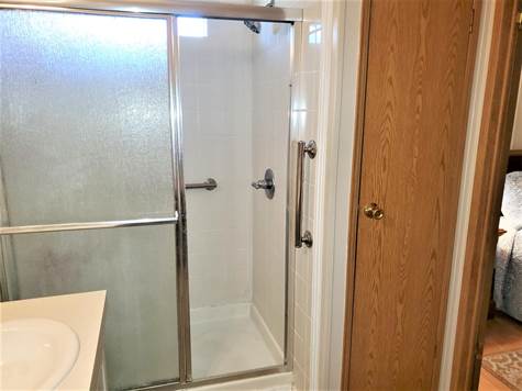 STEP-IN SHOWER AND LINEN CLOSET