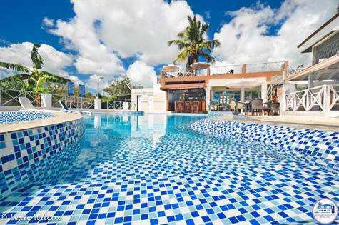 nicely tiled pool - view to bar- dining areas