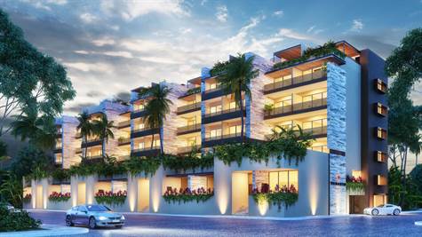 LUXURY APARTMENT FOR SALE IN PLAYA DEL CARMEN FACADE AT NIGHT