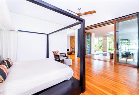 Masterbedroom with sliding glass doors to the pool