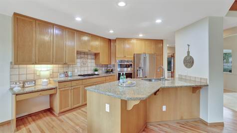 Fabulous kitchen with granite counters and eating bar.