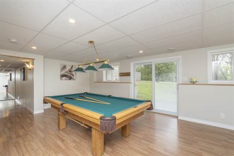 Finished Basement features a Fam Rm w/Laminate Floors & WALK OUT to Your Backyard!