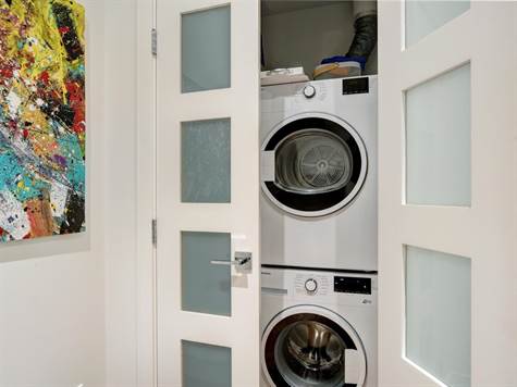 LAUNDRY ROOM WITH BUILT IN SHELVES