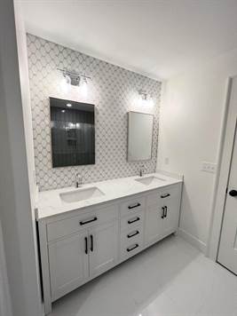 Double sink vanity, tile floor
