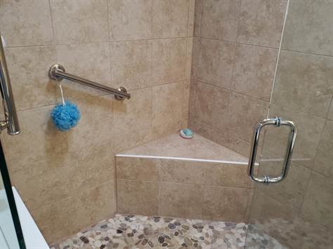 TILED WITH A SEAT AND GRAB BARS