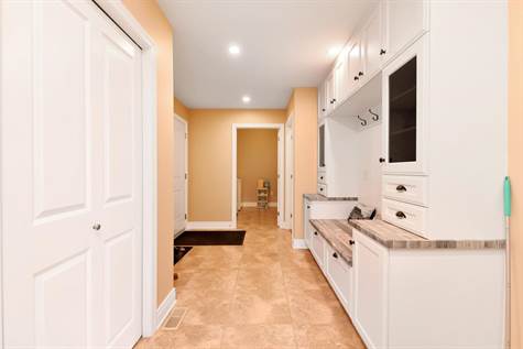 built in cabinetry and seating mud room