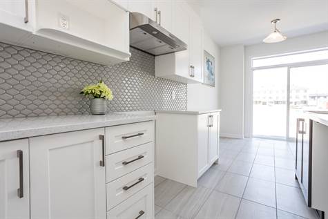 Modern Grey Tile Backsplash & White Quartz Counters