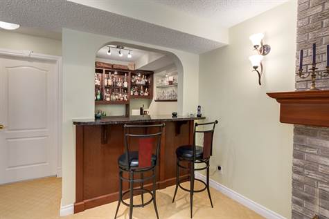 This is a practical bar in the basement with a wine cellar in the back.