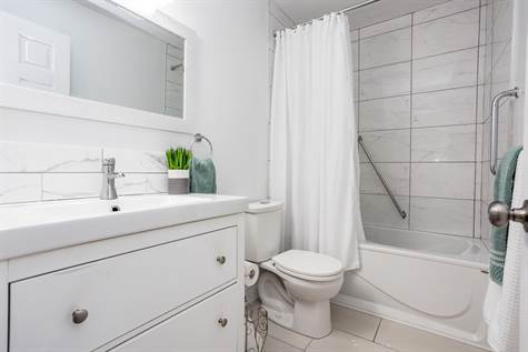 Fully Reno’d Main Bath w/Modern Tile on the Floors & In Shower