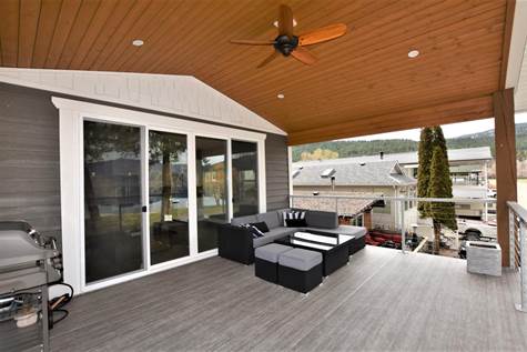 covered deck with a fan 
