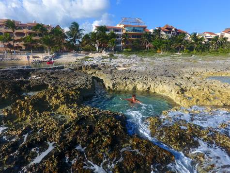 Stunning Beachfront Villa with private beach for Sale in Puerto Aventuras