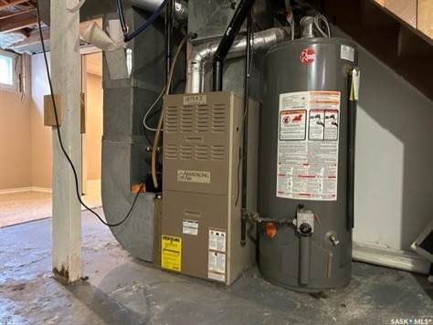 Natural gas forced air furnace and water heater