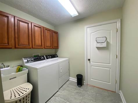 Laundry with sink & nice cabinetry