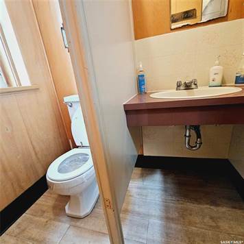 Bathroom sink, backsplash, and toilet