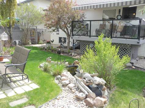 Yard with a relaxing bubbler and active creek