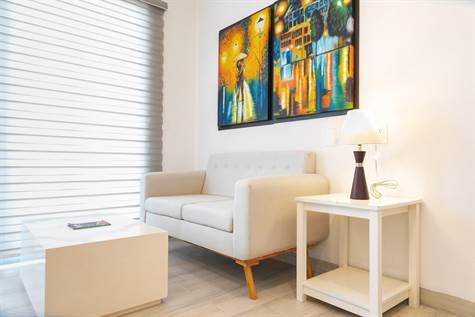 DEPARTAMENTOS Y TOWNHOUSES FOR SALE EN PUERTO AVENTURAS LIVING ROOM with sofa