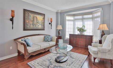 Living Room with Bay Window & Hardwood Floor
