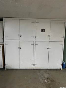 Parking stall with storage lockers