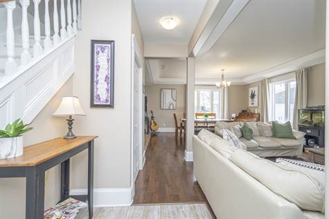 Living Room Features Engineered Hardwood Floors throughout & 9 Ft Bulkhead Ceiling