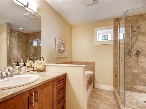 MASTER BATHROOM WITH GLASS SHOWER AND RADIANT FLOOR