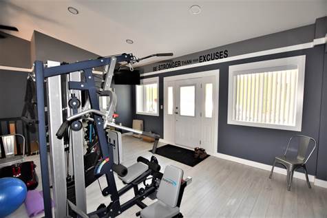 the exercise room showing entrance from the driveway side of the home 