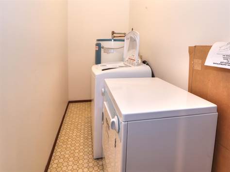 Laundry located near bedrooms