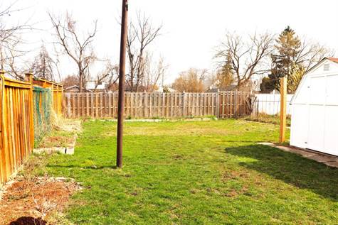 Big fenced yard for children and pets to play safely 