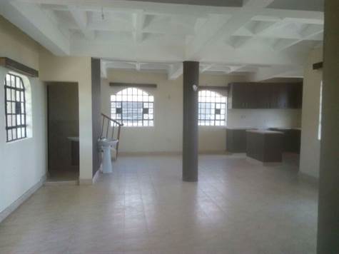 2. The Living room and open Kitchen for the property for sale in Naivasha