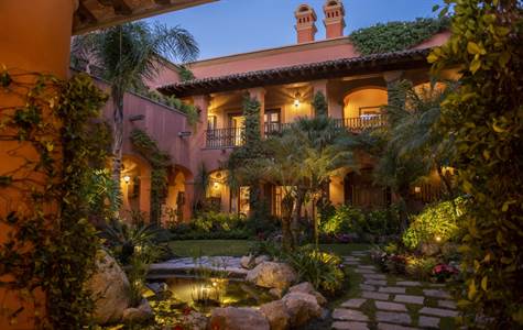 Dramatic central courtyard with mature landscaping