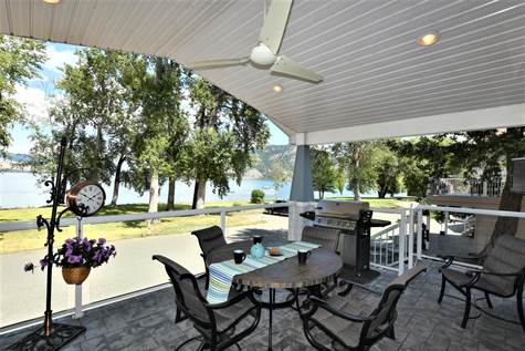 Large covered front deck out from the kitchen