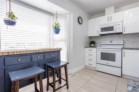 Fully Renovated Kitchen w/Eat In Space Beside Large Bay Window