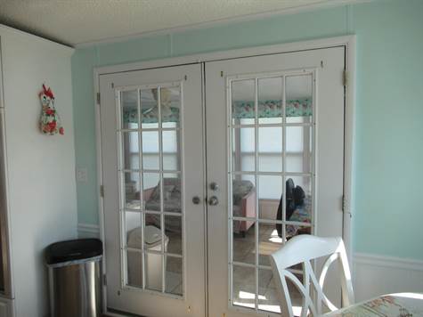 Doors to enclosed sunroom
