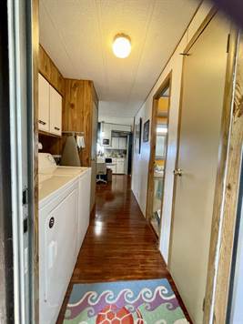 LOOKING OUT FROM SHED/STORAGE INTO LAUNDRY, BATH & KITCHEN HALL