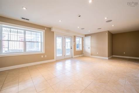 The lower level family room offers a rough-in for a kitchenette in the alcove with 220 volt wiring available. The lower level patio is wired for a hot tub. The lower level is also wired for sound