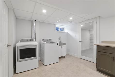 Laundry room. Bright and spacious. New washer and dryer plenty of room for storage too