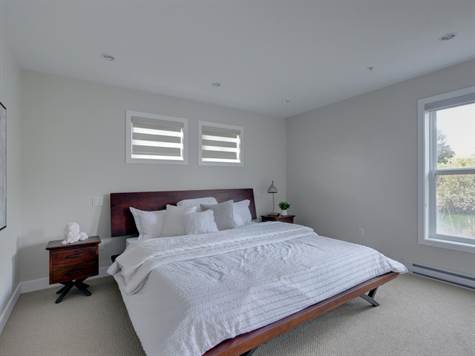 MASTER BEDROOM EASILY ACCOMMODATES THIS KING SIZE BED