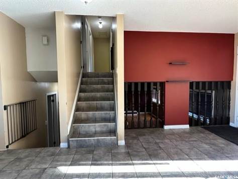 Stairs to upper level and family room level