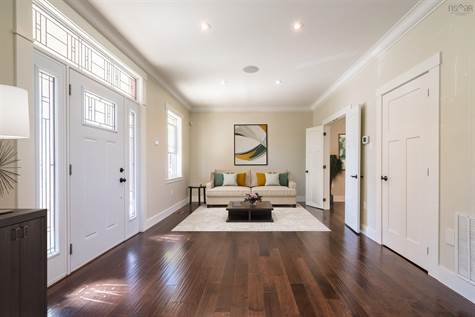 Virtually staged to demonstrate just how spacious the room is. Have a baby grand? There is room for that! Ceilings are 9' on the main floor. Your interior decorate will love helping you with all the spacious and design of this fantastic home.